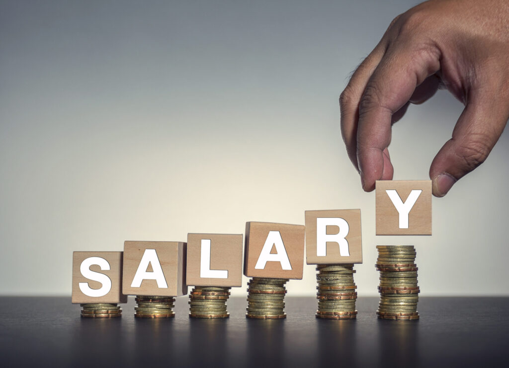 Coin,stacks,with,letter,wooden,blocks, ,salary